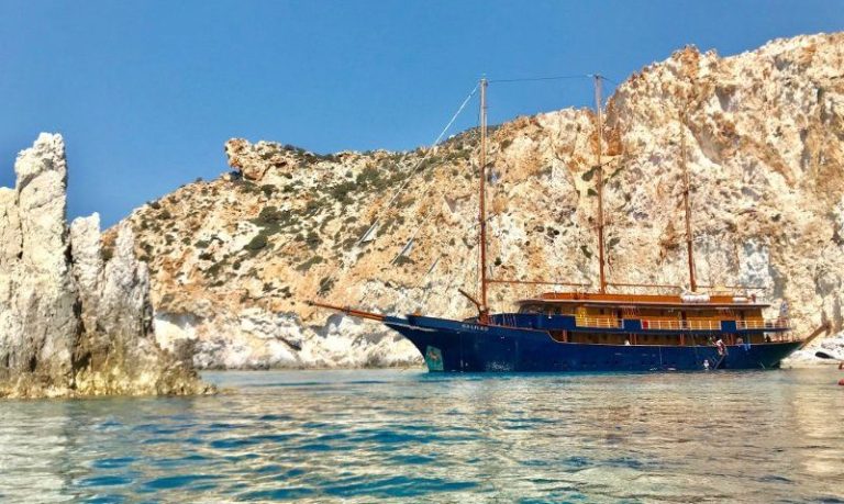M/S Galileo at anchor beneath limestone cliffs