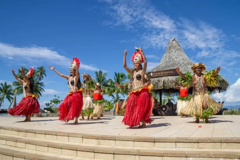 Polynesian dancers performing in traditional dress