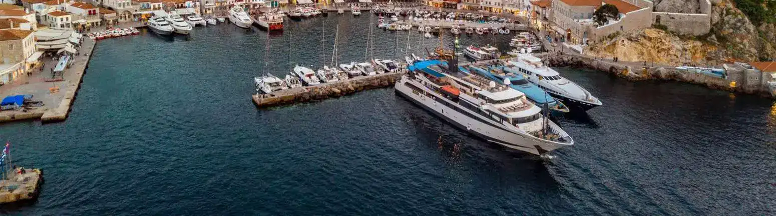 M/Y Variety Voyager moored in a Greek island harbour, seen from the air