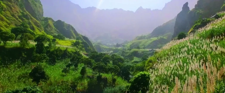 Lush green valleys and towering peaks seen during a Cape Verde cruise island-hopping adventure