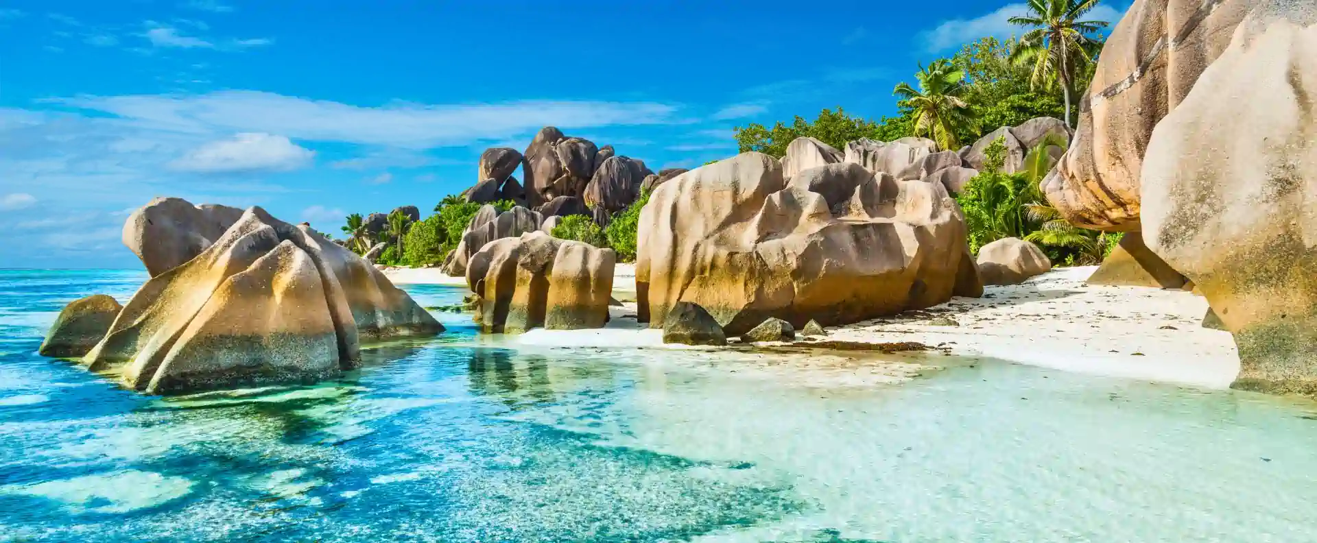 Granite rock formations and clear water at Anse Source d’Argent, a top stop on Seychelles small ship cruising routes.
