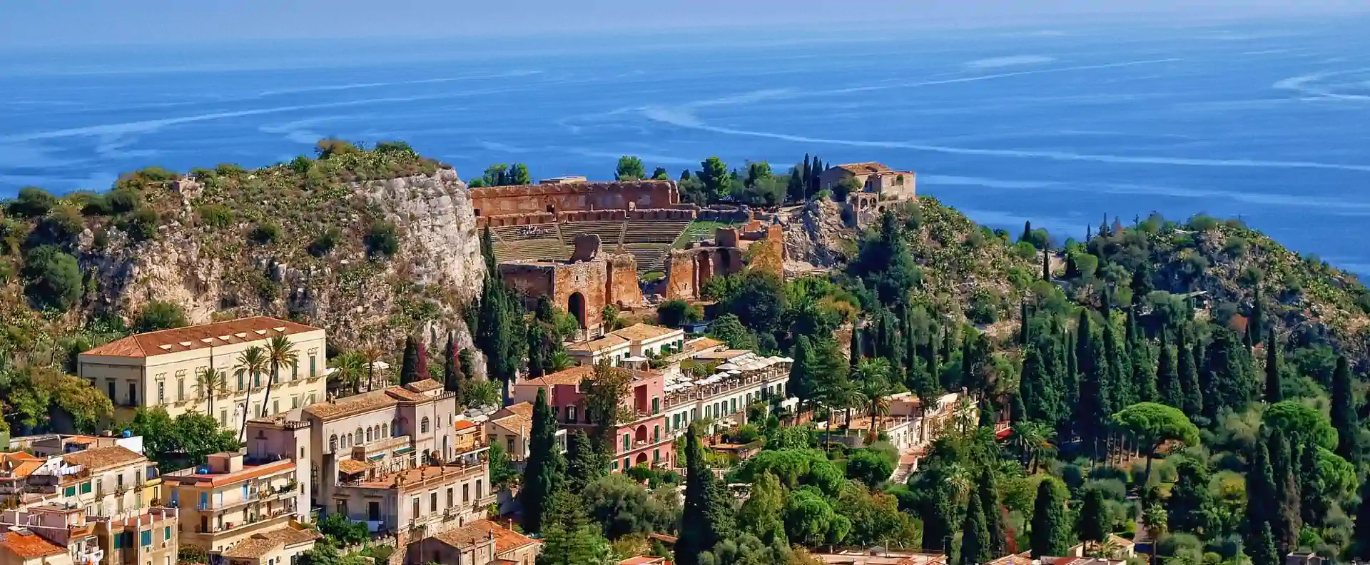 The ancient Greek Theatre in Taormina overlooking the sea, a top site in Sicily travel