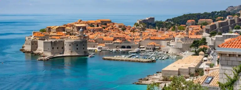 "Panoramic view of Dubrovnik’s Old Town and historic city walls overlooking the Adriatic Sea, a highlight of the Venetian Horizons Italy, Slovenia & Croatia cruise with Seafarer Cruises"