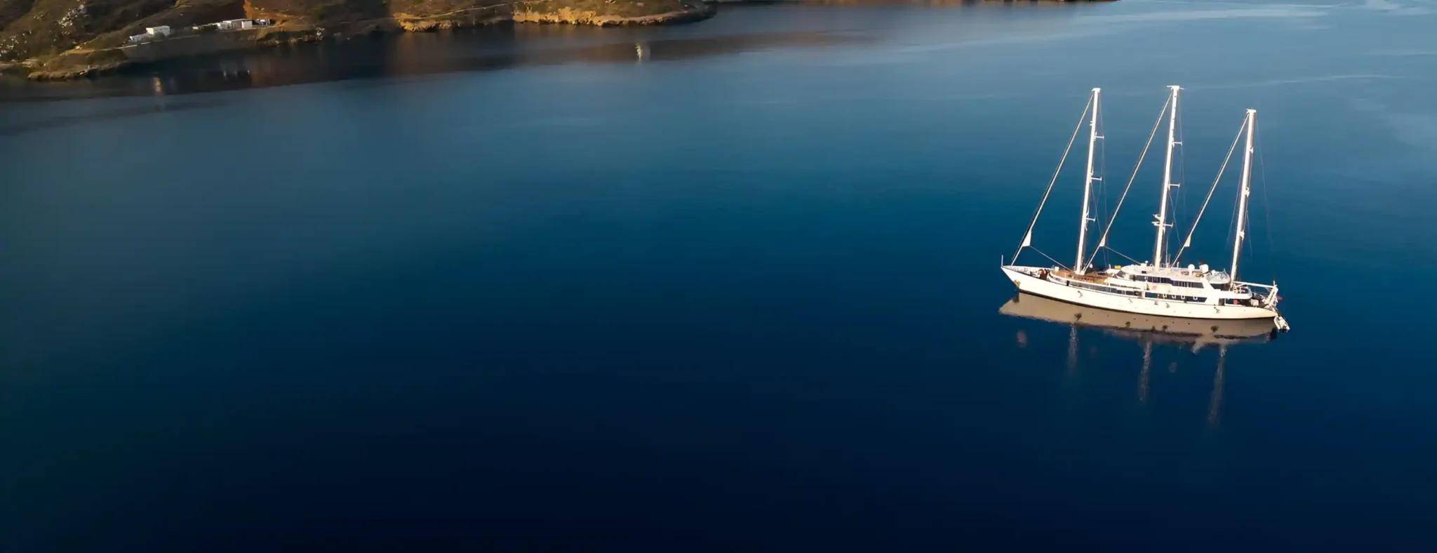 M/S Panorama at anchor in a calm bay at dusk
