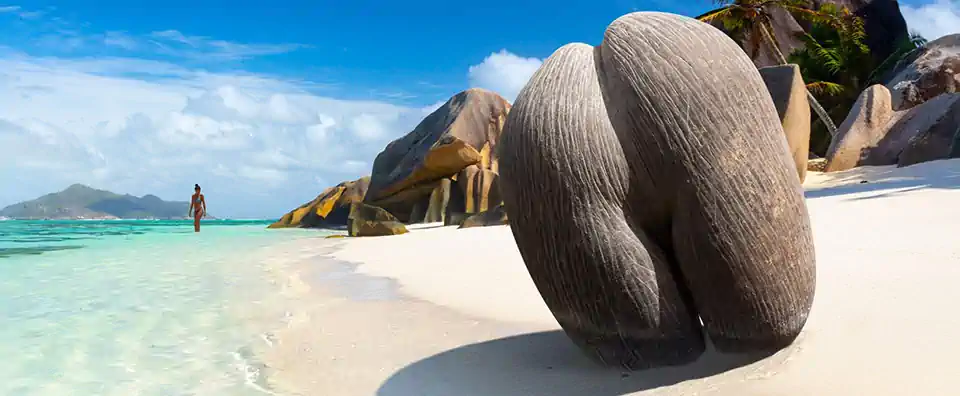 Seychelles island hopping at Anse Source d’Argent, La Digue—granite boulders, white sand and turquoise water.
