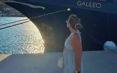 greek-coastal-cruise-ms-galileo-marina-zea-bow-sunset Nellie on the quay looking toward MS Galileo’s bow at sunset in Marina Zea during a Greek coastal cruise.