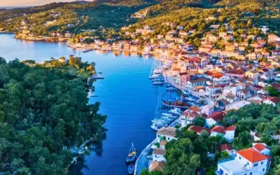 Aerial view of a Greek island harbour town with moored boats, Greece cruise holiday