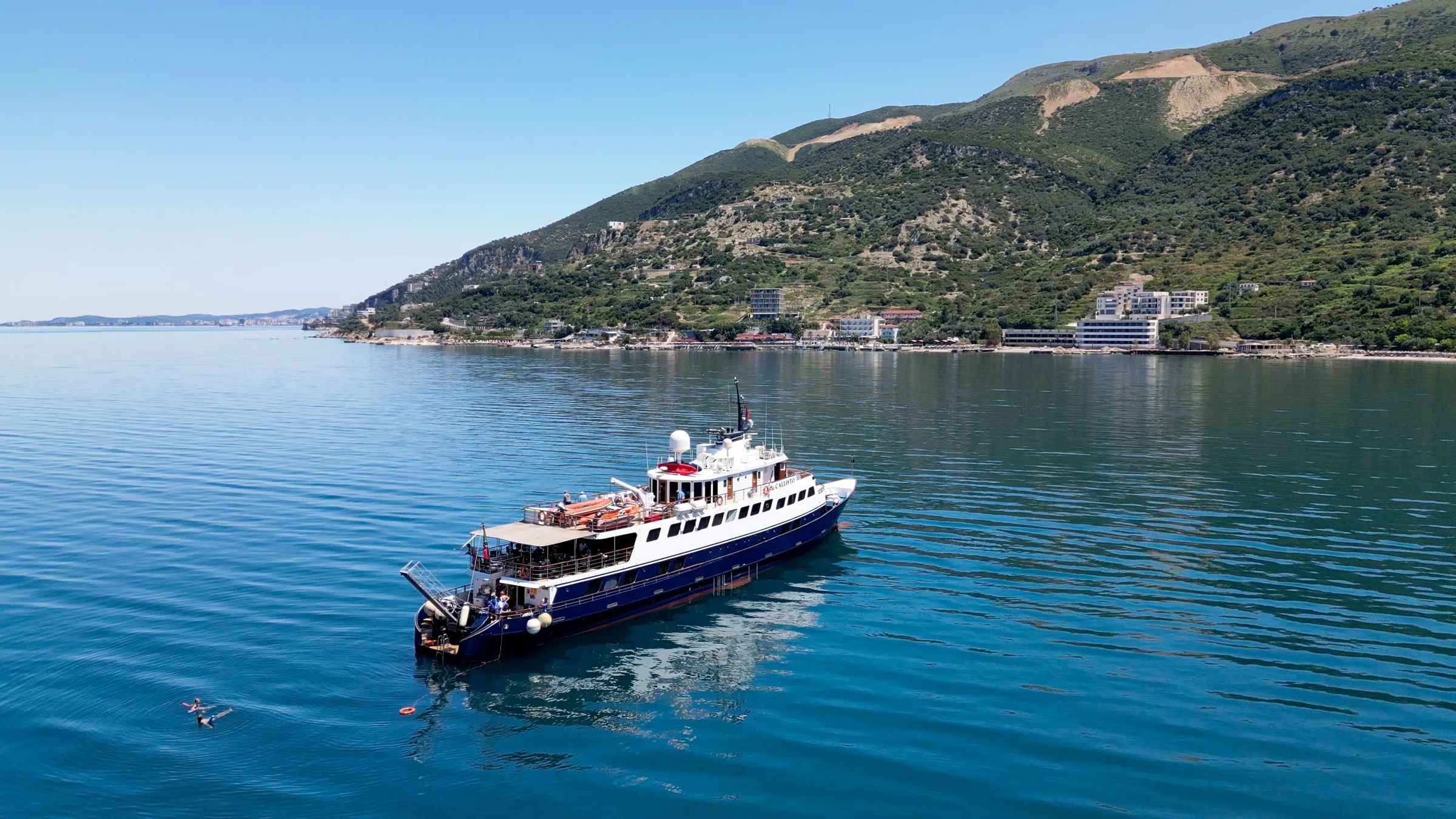 M/Y Callisto at anchor in a calm bay