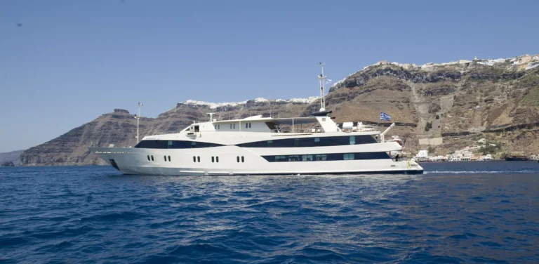 M/Y Harmony V below the cliffs of Santorini