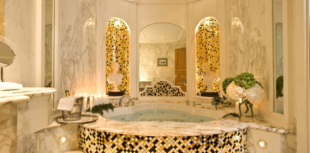 Suite bathroom with hot tub at the Royal Olympic Hotel