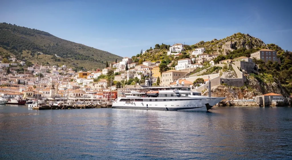 Variety Voyager at anchor off an island town